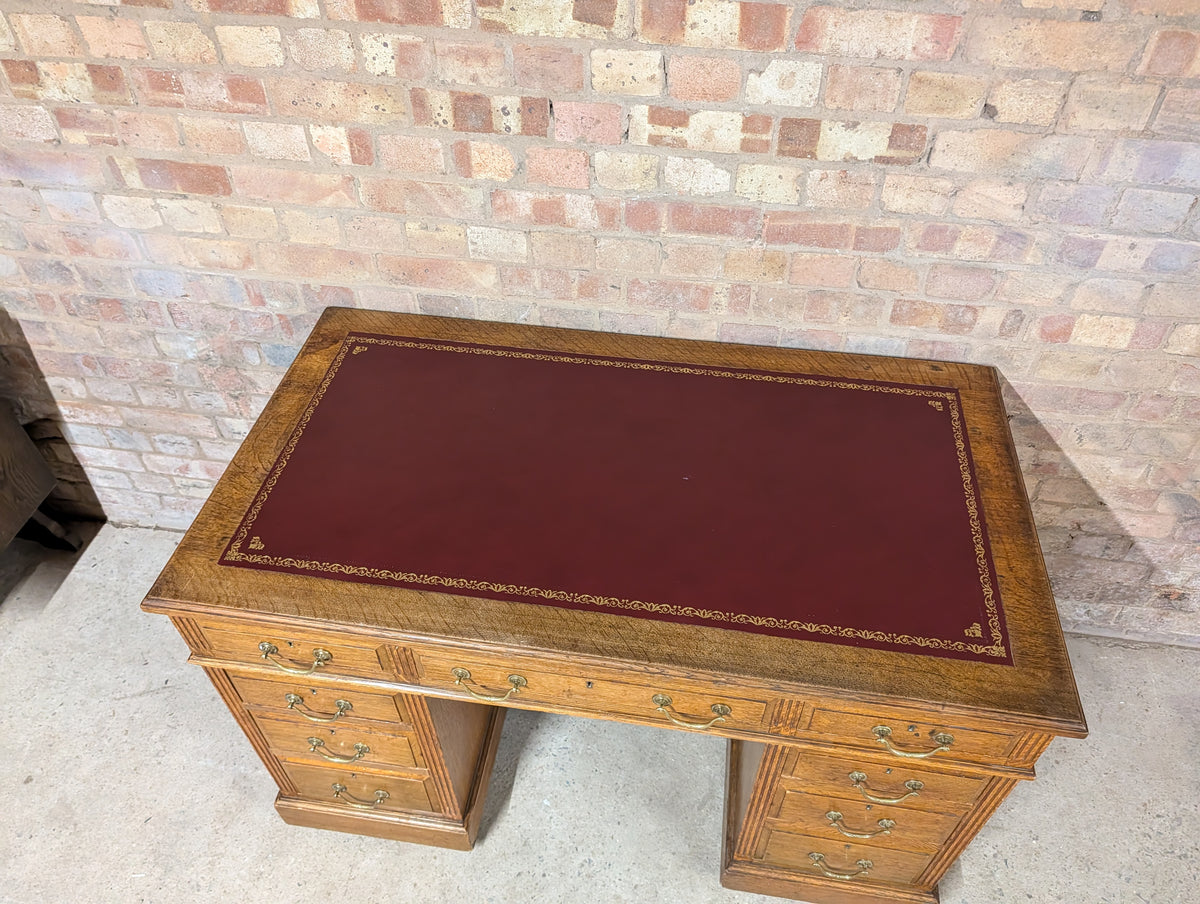 Early 20th Century Maple & Co Antique Oak Leather Top Writing Desk - 9 Drawer